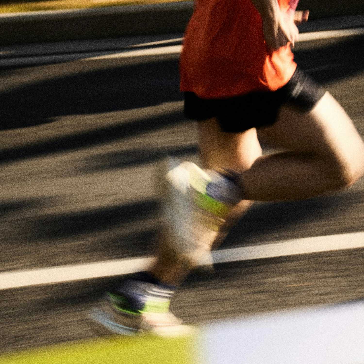 Person running on a track with blurred motion